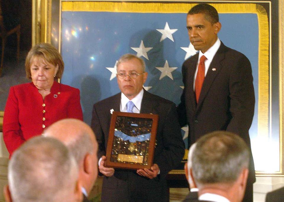 President Barack Obama in 2009 presents the Medal of Honor to Janet and Paul Monti, the parents of Sgt. Jared C. Monti of Raynham.
