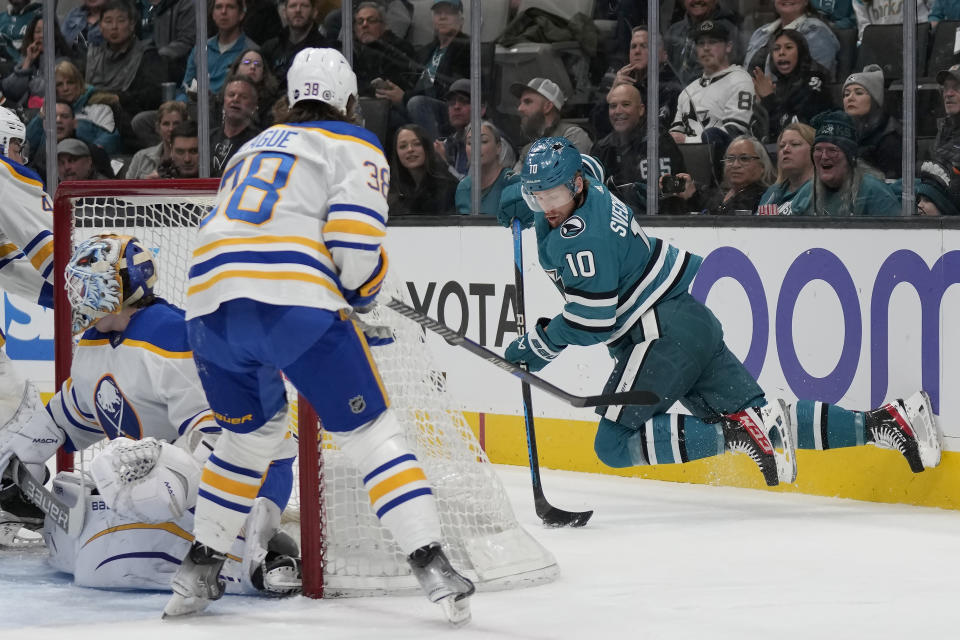 San Jose Sharks left wing Evgeny Svechnikov (10) passes the puck behind the goal during the first period of an NHL hockey game against the Buffalo Sabres in San Jose, Calif., Saturday, Feb. 18, 2023. (AP Photo/Jeff Chiu)