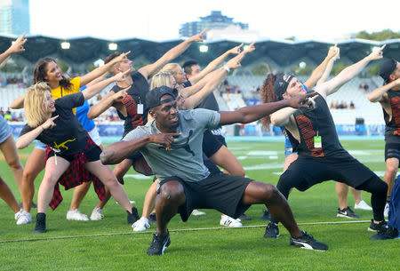 Olympic champion Usain Bolt dances with entertainers before the start of the Nitro Athletics series at the Lakeside Stadium in Melbourne, Australia February 4, 2017. REUTERS/Hamish Blair