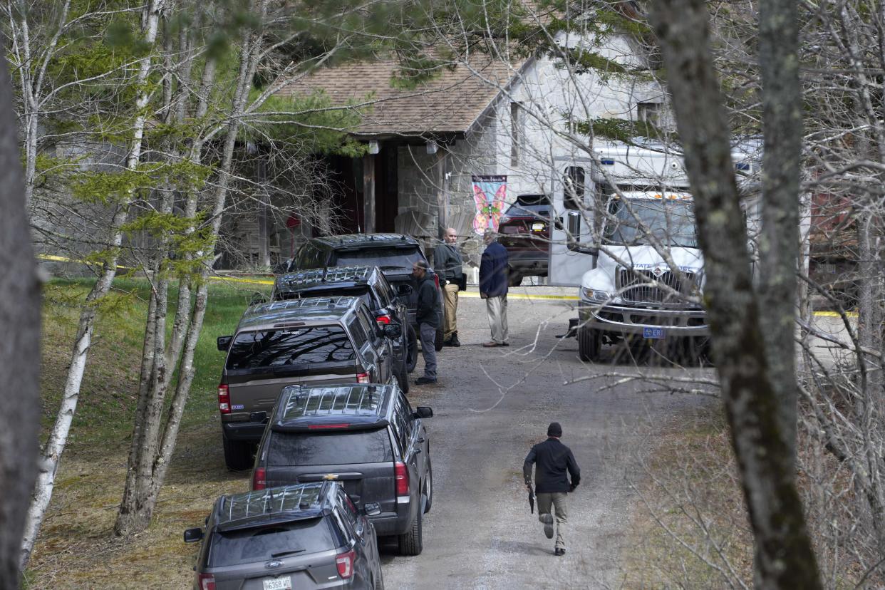 Investigators work at the scene of a deadly shooting, Tuesday, April 18, 2023, in Bowdoin, Maine. (AP Photo/Robert F. Bukaty)