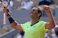 Spain's Rafael Nadal waves after defeating Argentina's Diego Schwartzman in their quarterfinal match of the French Open tennis tournament at the Roland Garros stadium Wednesday, June 9, 2021 in Paris. (AP Photo/Michel Euler)