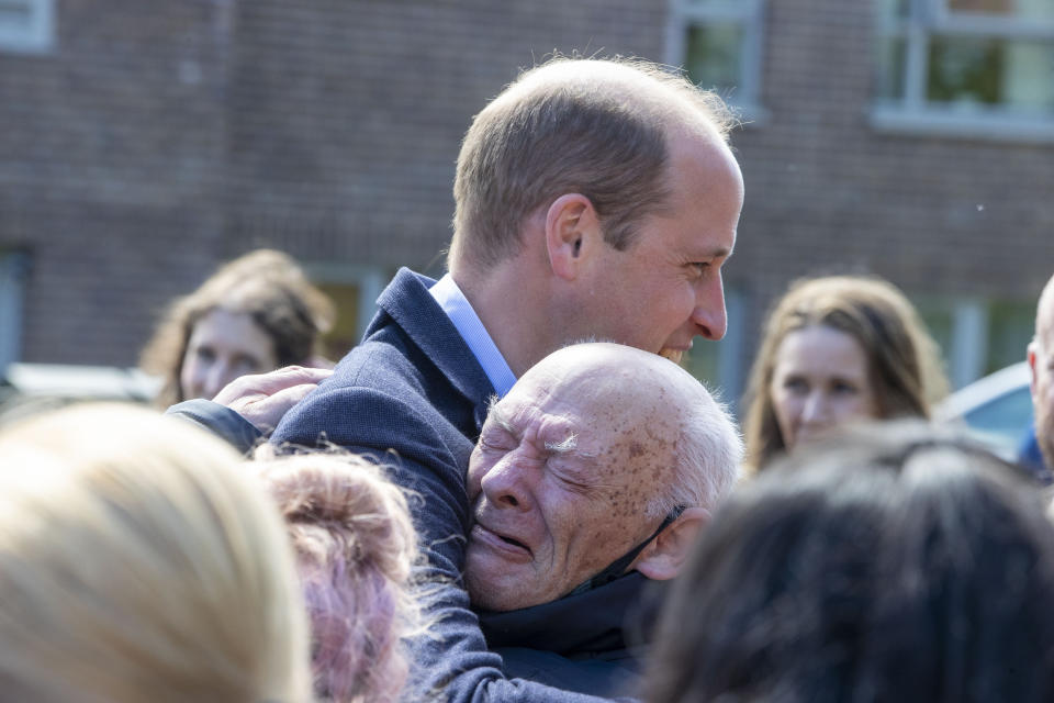 Prince William hugs an emotional resident, during a visit to the Wheatley Group in Glasgow, to hear about the challenges of homelessness in Scotland. (PA Images)