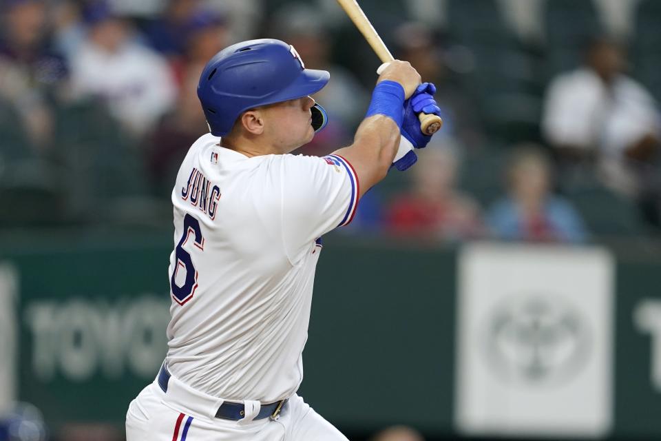 Texas Rangers' Josh Jung follows through on an RBI double during the first inning of the team's baseball game against the Oakland Athletics in Arlington, Texas, Tuesday, Sept. 13, 2022. (AP Photo/Tony Gutierrez)