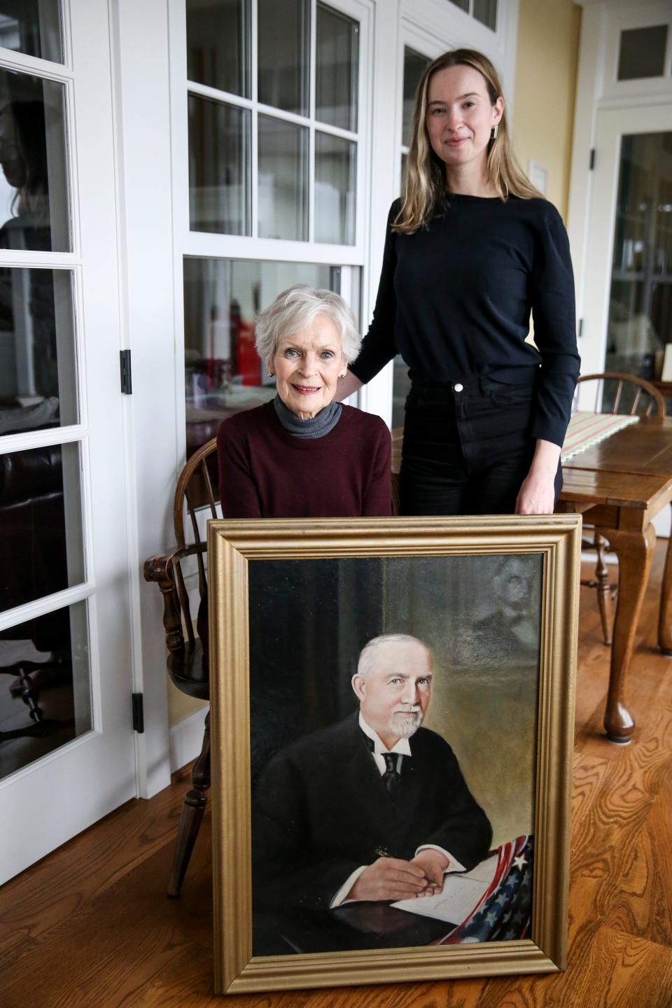 Kathy and Claire Withycombe with a portrait of Gov. Withycombe on Thursday, Nov. 11, 2021, in Hillsboro, Ore.