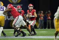 Georgia quarterback Stetson Bennett (13) looks for an open receiver in the first half of the Southeastern Conference Championship football game against the LSU Saturday, Dec. 3, 2022 in Atlanta. (AP Photo/John Bazemore)