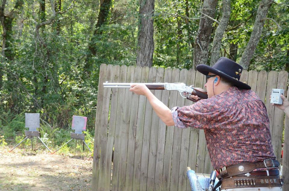 Don Carlton, aka "Buck D. Law," who owns a printing business in Rainbow City, shoots in events sanctioned by the Single Action Shooting Society.