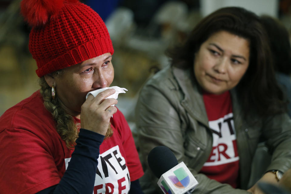 <p>El Salvador immigrants Diana Paredes, left, and Isabel Barrera, react at a news conference following an announcement on Temporary Protected Status for nationals of El Salvador, in Los Angeles, Monday Jan. 8, 2018. (Photo: Damian Dovarganes/AP) </p>