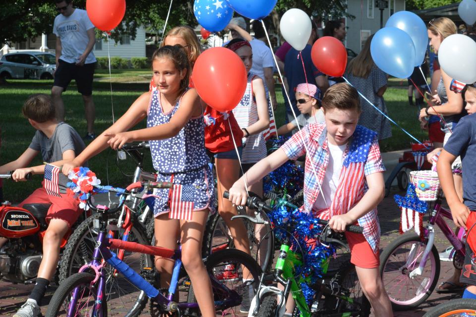 Neighborhood children ride festive bicycles in the annual Potwin Fourth of July Parade in 2018.