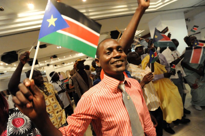 A Southern Sudanese refugee waves a South Sudan flag during independence celebrations in Tel Aviv, Israel, July 10, 2011. Israeli Prime Minister Benjamin Netanyahu announced Sunday that Israel would recognize South Sudan after it declared itself an independent state. File Photo by Debbie Hill/UPI