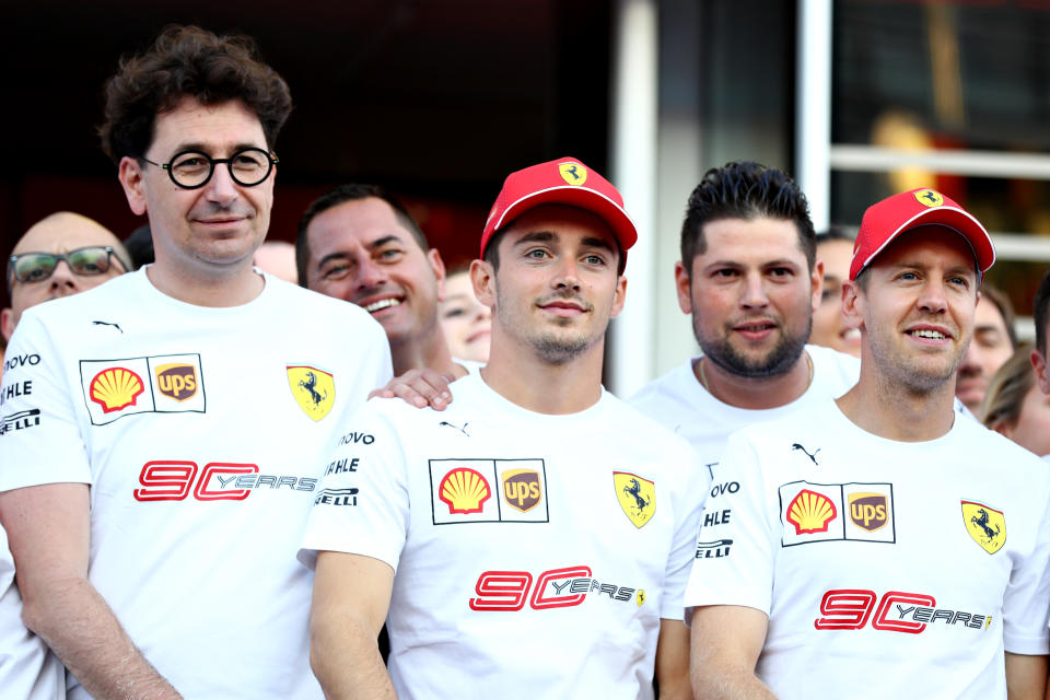 MONZA, ITALY - SEPTEMBER 07: Sebastian Vettel of Germany and Ferrari, Charles Leclerc of Monaco and Ferrari, Ferrari Team Principal Mattia Binotto and the Ferrari team pose for a photo in 90th anniversary t-shirts after qualifying for the F1 Grand Prix of Italy at Autodromo di Monza on September 07, 2019 in Monza, Italy. (Photo by Mark Thompson/Getty Images)