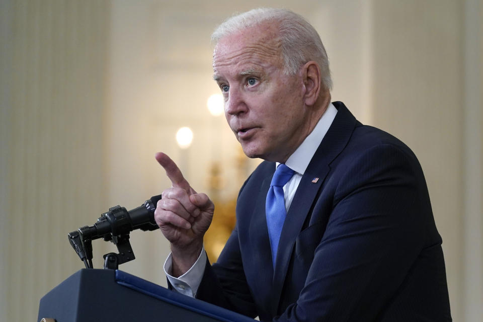 President Joe Biden gesturing as he takes questions from reporters as he speaks about the American Rescue Plan, in the State Dining Room of the White House, Wednesday, May 5, 2021, in Washington. (AP Photo/Evan Vucci)