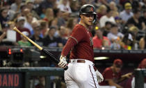 Arizona Diamondbacks' Christian Walker looks back at the umpire after a strike three call during the fourth inning of a baseball game against the San Francisco Giants, Sunday Sept. 25, 2022, in Phoenix. (AP Photo/Darryl Webb)