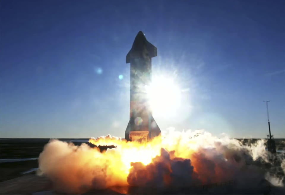 In this screen grab from video posted by SpaceX, the company's Starship launches for a test flight, Wednesday, Dec. 9, 2020, in a remote area of Texas. (SpaceX via AP)