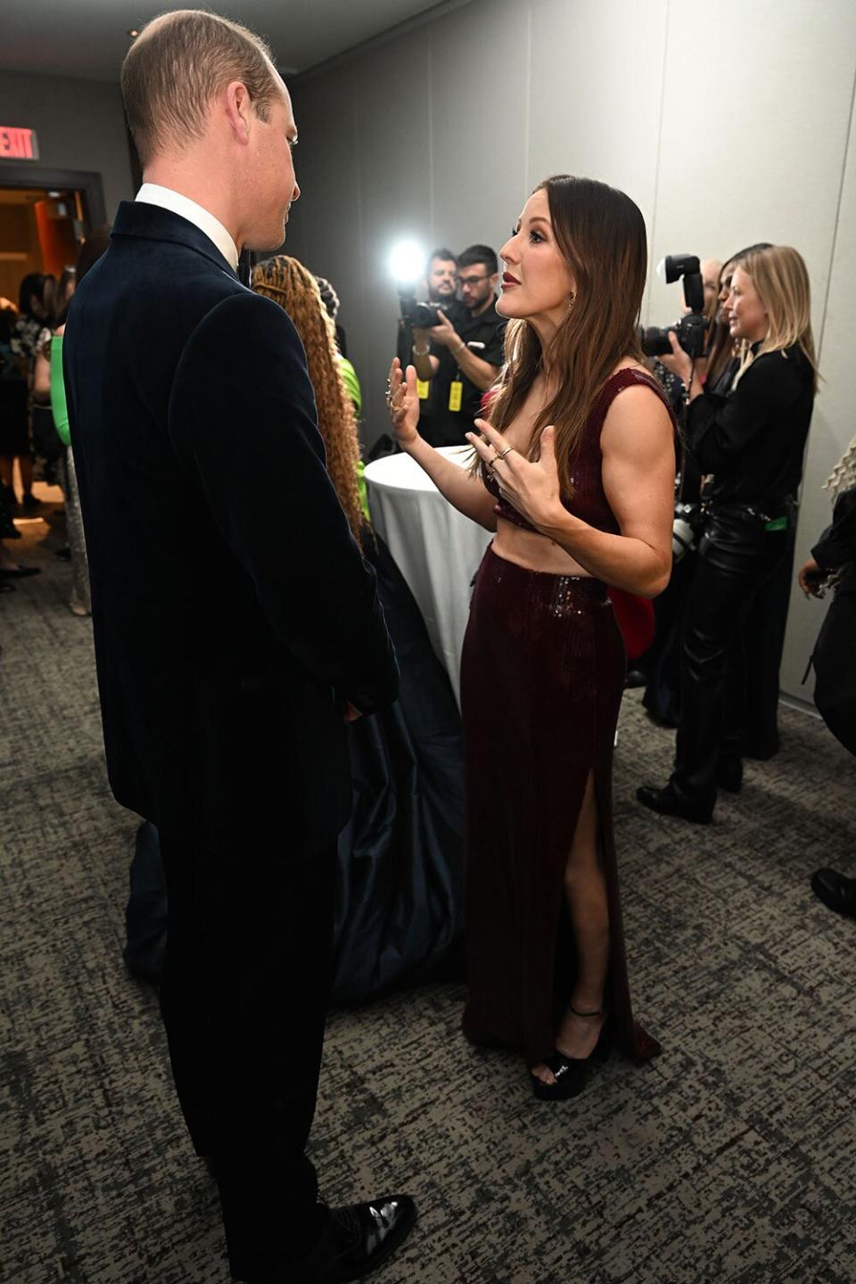 BOSTON, MASSACHUSETTS - DECEMBER 02: Prince William, Prince of Wales, Catherine, Princess of Wales and Ellie Goulding speak backstage after The Earthshot Prize 2022 at MGM Music Hall at Fenway on December 02, 2022 in Boston, Massachusetts. The Prince and Princess of Wales are visiting the coastal city of Boston to attend the second annual Earthshot Prize Awards Ceremony, an event which celebrates those whose work is helping to repair the planet. During their trip, which will last for three days, the royal couple will learn about the environmental challenges Boston faces as well as meeting those who are combating the effects of climate change in the area. (Photo by Samir Hussein/WireImage)