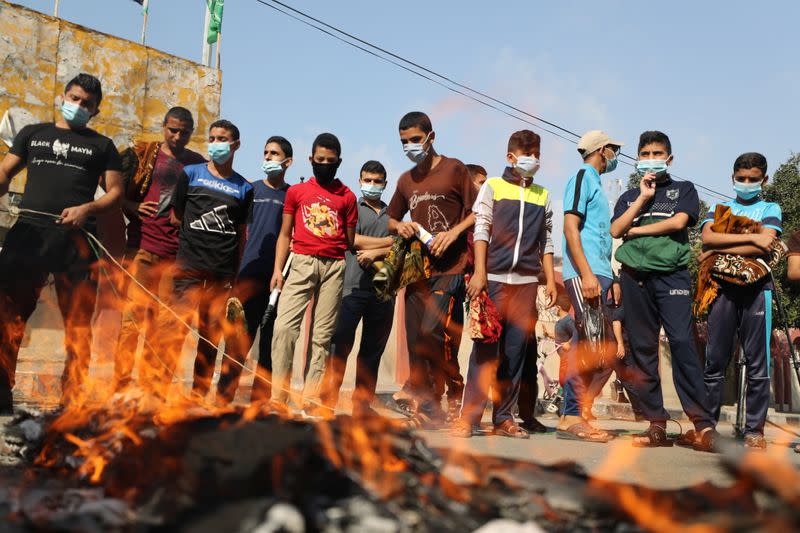 Palestinians gather to protest against the publications of a cartoon of Prophet Mohammad