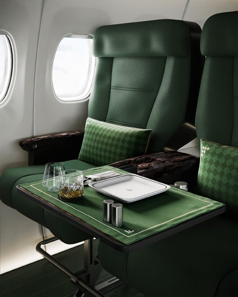 Green interior seats on a Fleet Clubs private plane.