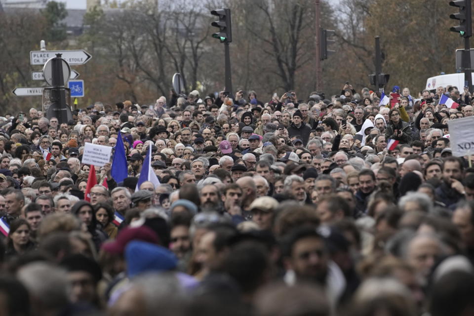 Thousands gather for a march against antisemitism in Paris, France, Sunday, Nov. 12, 2023. French authorities have registered more than 1,000 acts against Jews around the country in a month since the conflict in the Middle East began. (AP Photo/Christophe Ena)