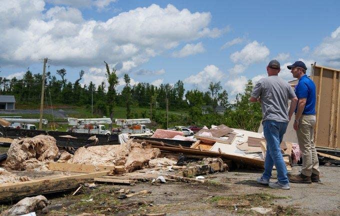 Kentucky Gov. Andy Beshear (L) toured wreckage caused by storms that hit his state over the weekend. At least five people died as a result of the severe weather in Kentucky, he said. Photo courtesy of Kentucky Gov. Andy Beshear/X