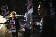 Workers demonstrative outside a General Motors facility in Langhorne, Pa., Tuesday, Sept. 17, 2019. More than 49,000 members of the United Auto Workers walked off General Motors factory floors or set up picket lines early Monday as contract talks with the company deteriorated into a strike. (AP Photo/Matt Rourke)