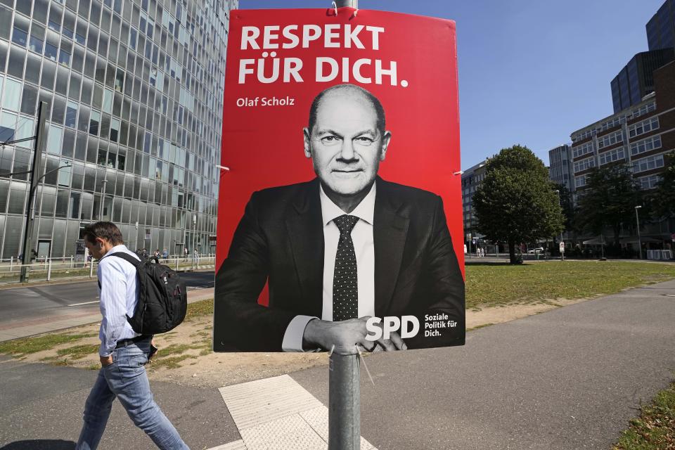 An election poster for the German Social Democrats, SPD, shows top candidate Olaf Scholz at a street in Duesseldorf, Germany, Wednesday, Aug. 25, 2021. A large chunk of the German electorate remains undecided going into an election that will determine who succeeds Angela Merkel as chancellor after 16 years in power. Recent surveys show that support for German political parties has flattened out, with none forecast to receive more than a quarter of the vote. (AP Photo/Martin Meissner)