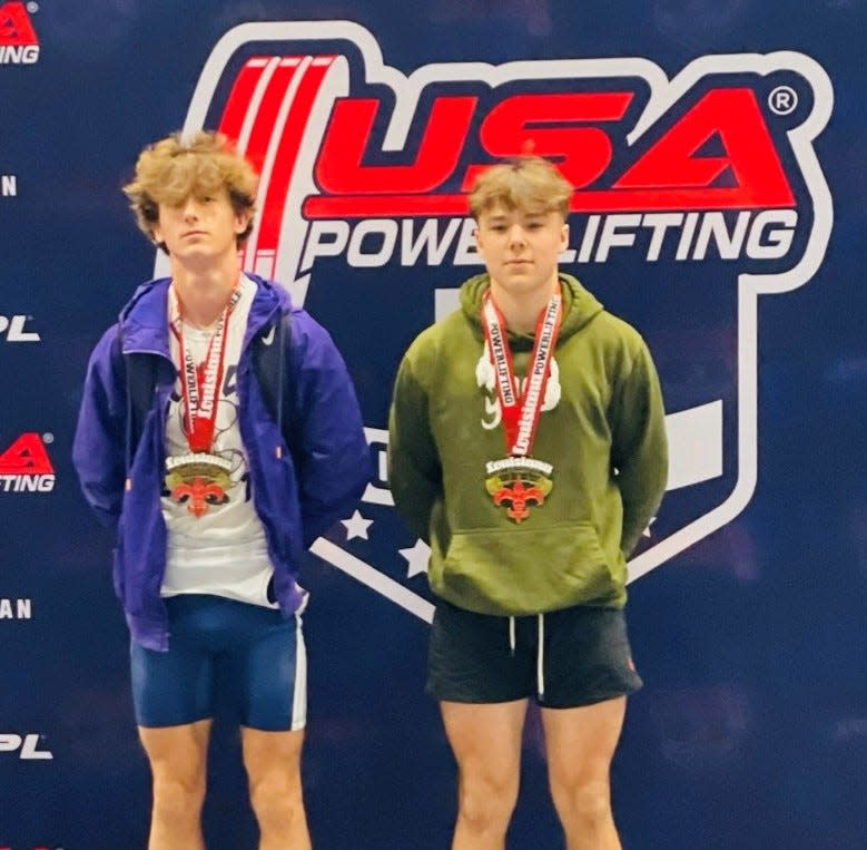 Loyola's Hugh Herzog (left) set a Louisiana record for the bench press at 123 pounds at the USA Powerlifting High School Nationals in Baton Rouge.