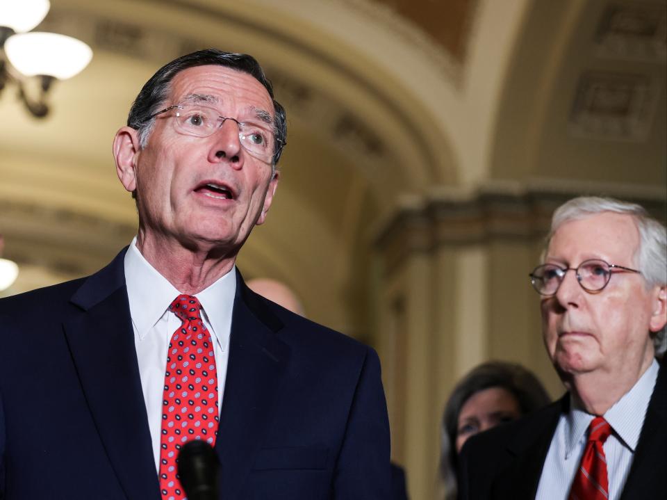 US Senator John Barrasso is flanked by Senate Minority Leader Mitch McConnell  (REUTERS)