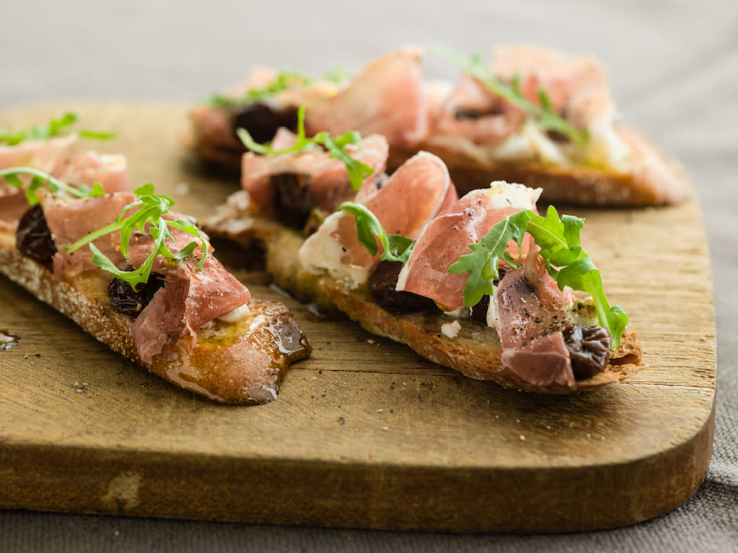 <p>Curtis Stone</p><p>A flavor burst from tart cherries, creamy goat cheese and salty prosciutto in every bite.</p><p><strong>Get the recipe: <a href="https://parade.com/230861/scottneumyer/curtis-stones-prosciutto-crostini-with-dried-cherries-and-goat-cheese/" rel="nofollow noopener" target="_blank" data-ylk="slk:Curtis Stone's Prosciutto Crostini with Dried Cherries and Goat Cheese;elm:context_link;itc:0;sec:content-canvas" class="link rapid-noclick-resp">Curtis Stone's Prosciutto Crostini with Dried Cherries and Goat Cheese</a></strong></p>