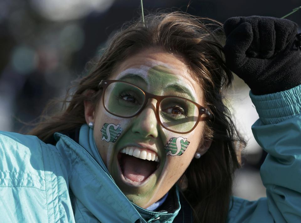 Saskatchewan Roughriders fan Lianne MacLean stands outside the stadium before the CFL's 101st Grey Cup championship football game in Regina, Saskatchewan November 24, 2013. REUTERS/Todd Korol (CANADA - Tags: SPORT FOOTBALL)