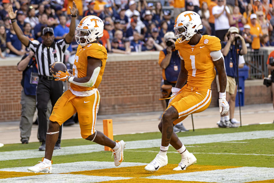 Tennessee running back Dylan Sampson (6) crosses the goal line ahead wide receiver Dont'e Thornton Jr. (1) during the second half of an NCAA college football game against UTSA, Saturday, Sept. 23, 2023, in Knoxville, Tenn. (AP Photo/Wade Payne)