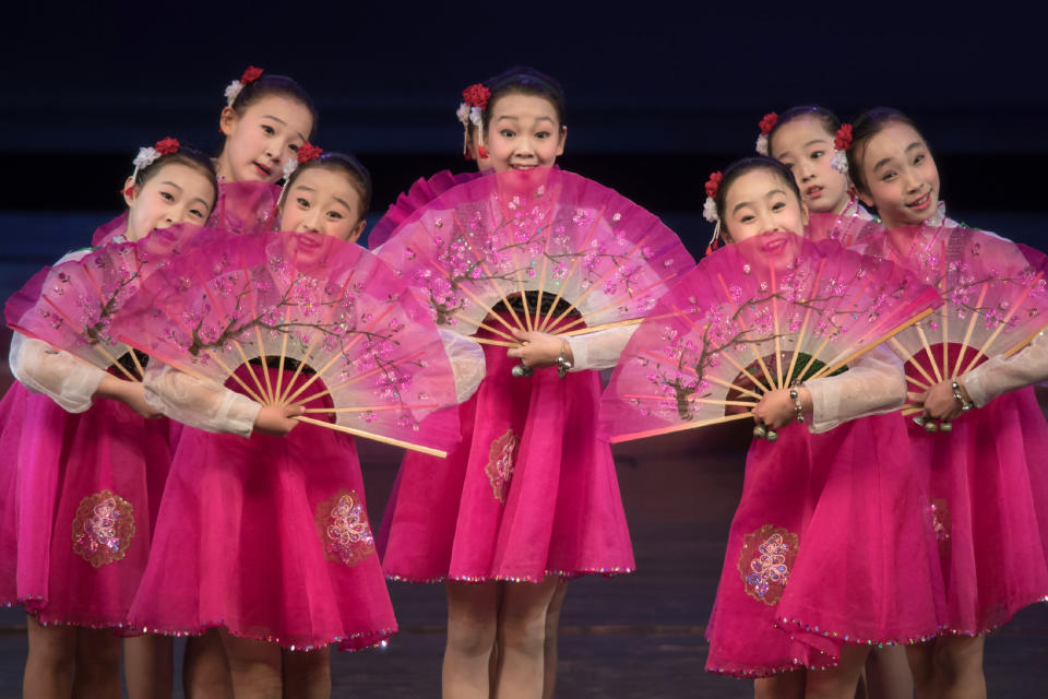 Children perform a dance and music show during an organized tour of the Childrens Cultural Palace for visiting foreign journalists on the outskirts of Pyongyang on April 14, 2017.