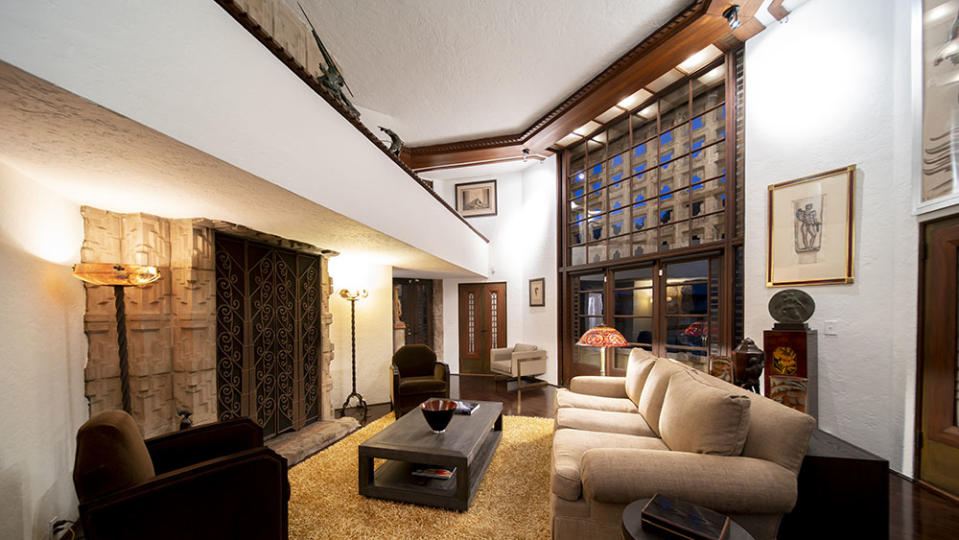 The floor-to-ceiling fireplace is a highlight of the living area. - Credit: Open House Foto