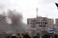 Smoke rises after explosions hit the Syrian city of Tartus on May 23, 2016. (SANA via Reuters)