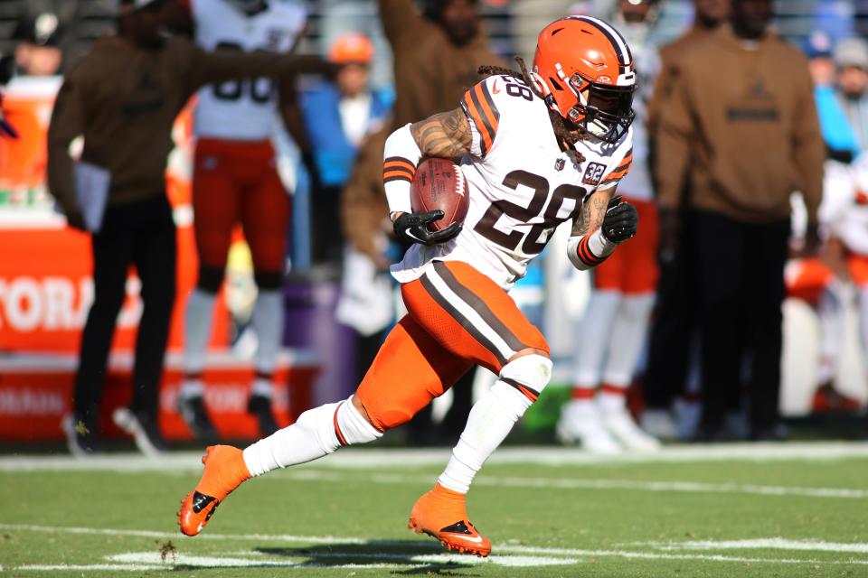 Cleveland Browns cornerback Mike Ford (28) returns an interception against the Baltimore Ravens on Sunday in Baltimore.