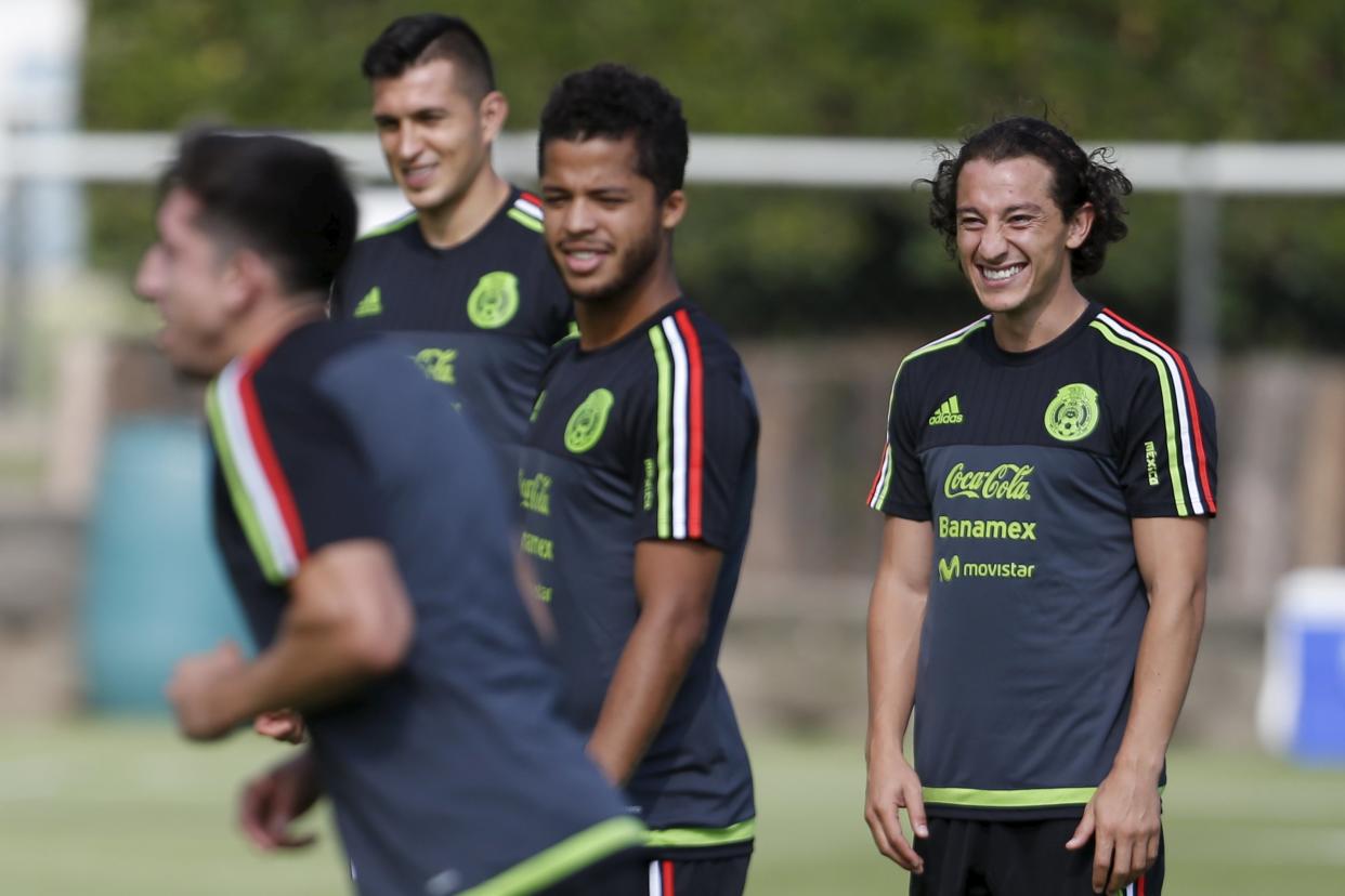 Mexico&#39;s soccer player Andres Guardado (R) smiles during a training session in Mexico City, Mexico, June 16, 2015. Mexico will play in the CONCACAF Gold Cup from July 7-26. REUTERS/Edgard Garrido