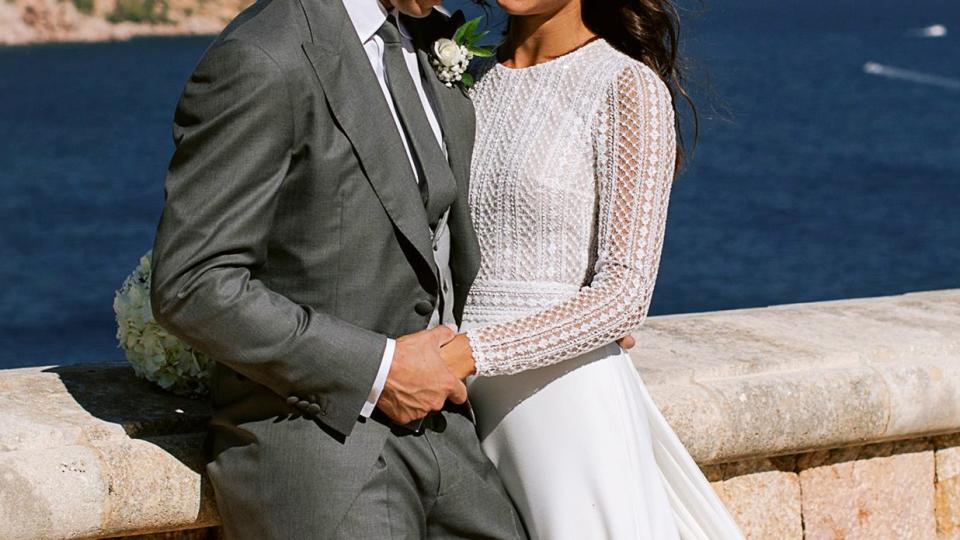 Rafa Nadal poses with wife Xisca Perello for the official wedding portraits after they were married on October 19, 2019 in Mallorca, Spain.