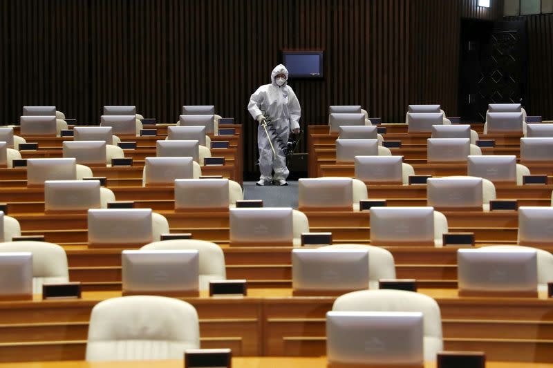 Employees from a disinfection service company sanitize the National Assembly in Seoul