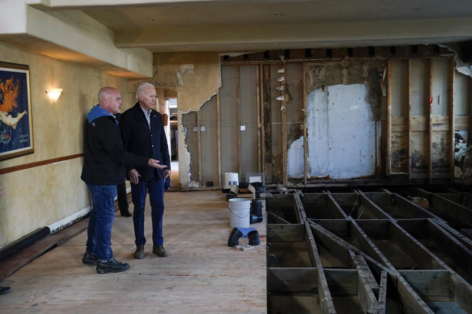 President Joe Biden talks with Paradise Beach Grille co-owner Chuck Maier as he visitswith business owners and local residentsin Capitola,Calif., Thursday, Jan 19, 2023,to survey recovery efforts following a series of severe storms. (AP Photo/Susan Walsh)