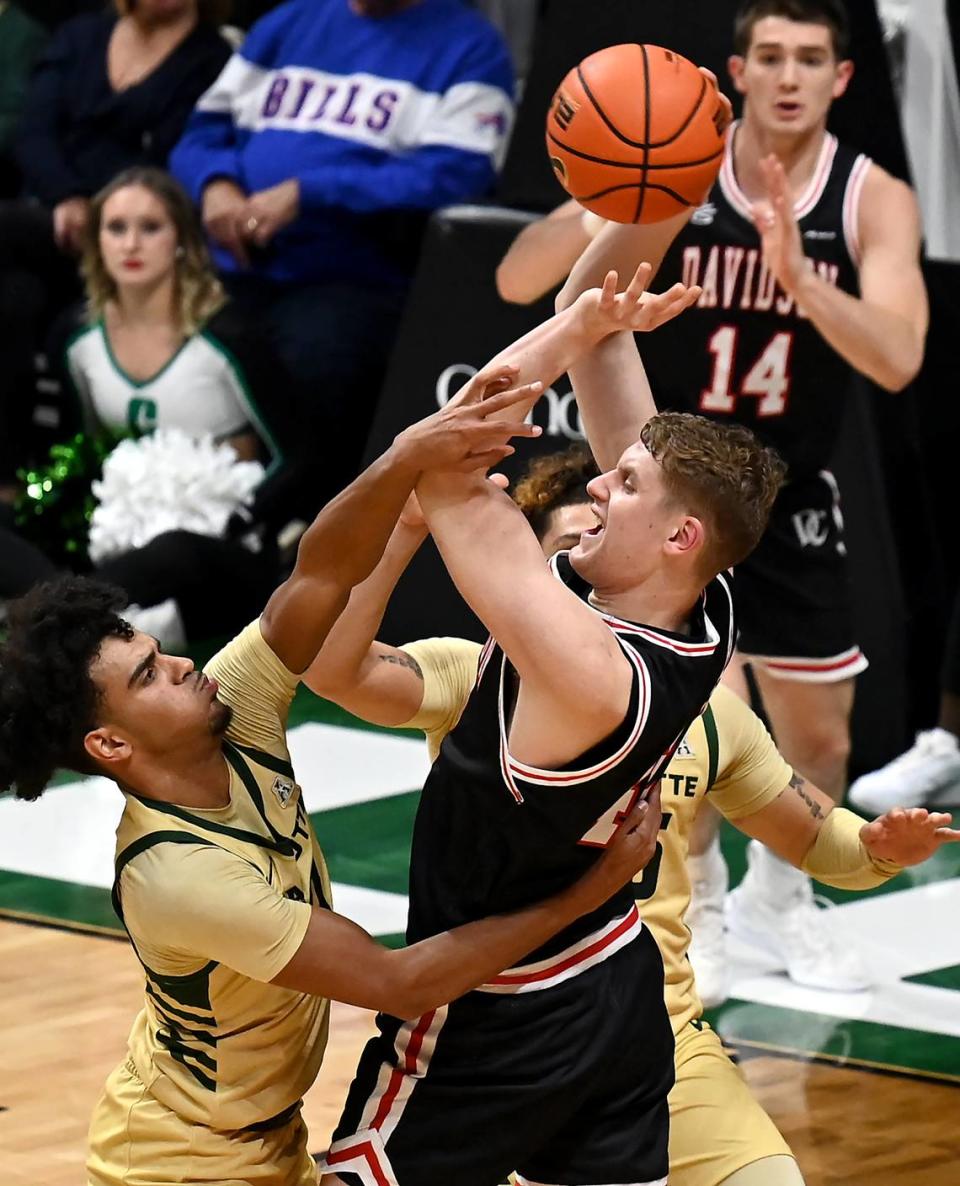 Davidson Wildcats David Skogman, center, fights to keep control of the ball as Charlotte 49er defenders surround him in the final moments of action on Wednesday, November 29, 2023 at Halton Arena. Davidson defeated Charlotte 85-81 to win the Battle for the Hornets Nest. JEFF SINER/jsiner@charlotteobserver.com