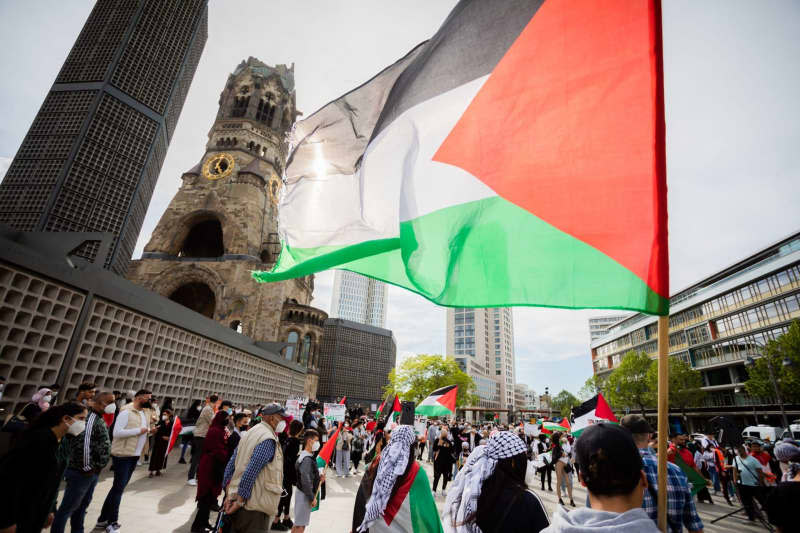 People take part in a Pro-Palestine rally in Berlin. Christoph Soeder/dpa