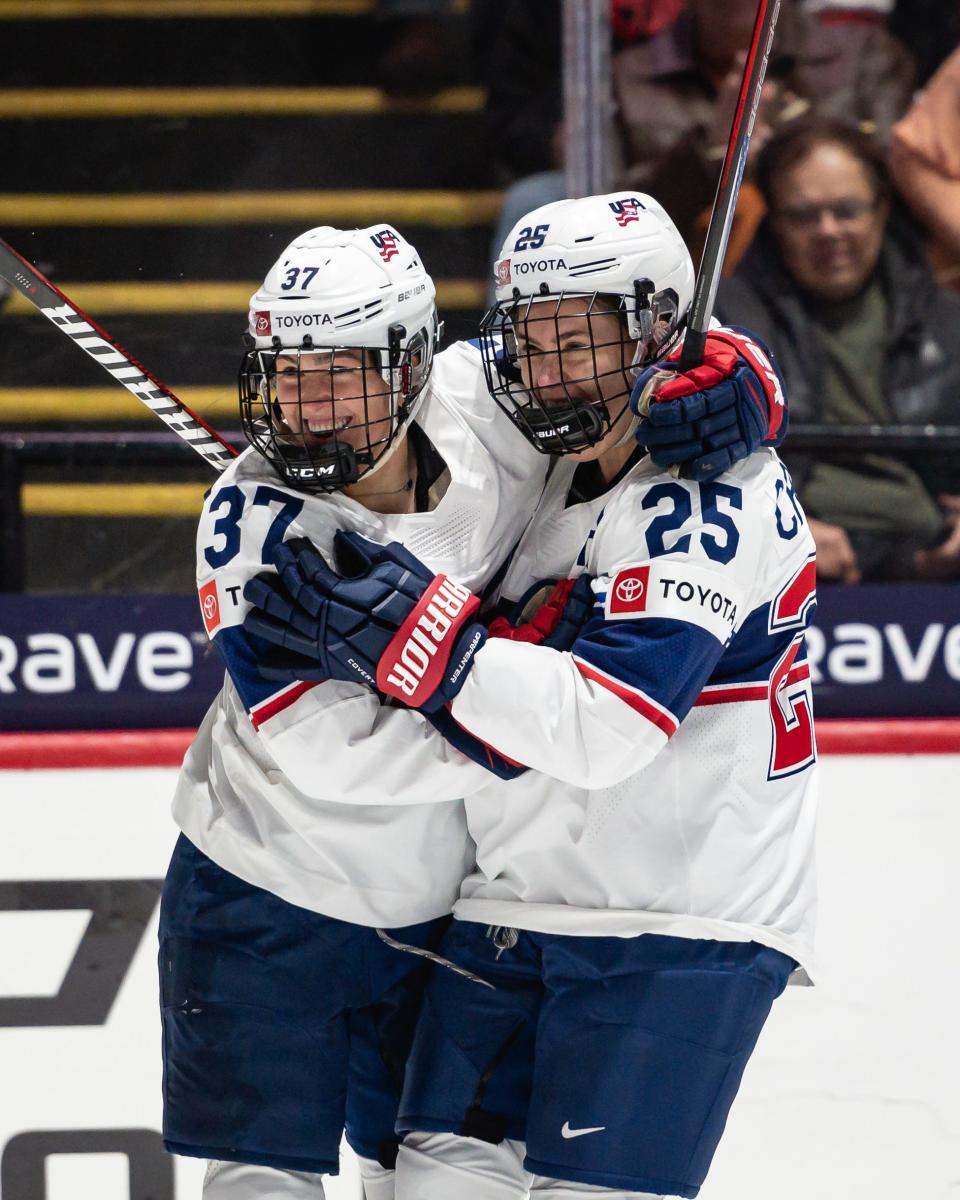 Team USA's Abbey Murphy (37) and Alex Carpenter celebrate after scoring against Finland in the first period at the Adirondack Bank Center Saturday.