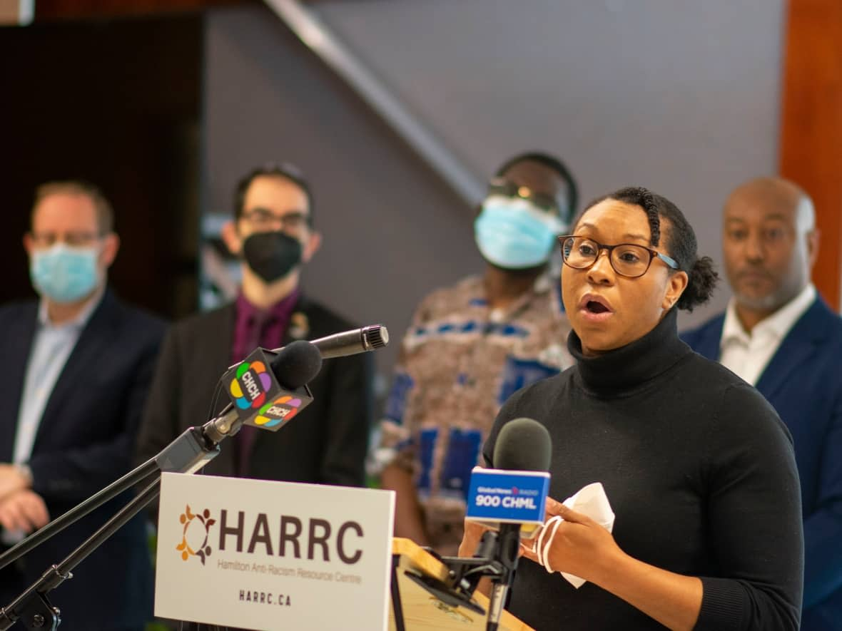 Amie Archibald-Varley spoke alongside community groups, rabbis and Hamilton's mayor on Friday at city hall calling on all levels of government to impose tougher laws against hate symbols and hate crimes. She spotted a Confederate flag in rural Hamilton, minutes from her home. (Bobby Hristova/CBC - image credit)