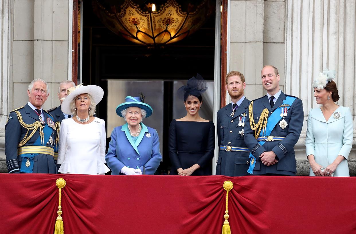 Prince Charles, Prince of Wales, Prince Andrew, Duke of York, Camilla, Duchess of Cornwall, Queen Elizabeth II, Meghan, Duchess of Sussex, Prince Harry, Duke of Sussex, Prince William, Duke of Cambridge and Catherine, Duchess of Cambridge watch the RAF flypast on the balcony of Buckingham Palace, as members of the Royal Family attend events to mark the centenary of the RAF on July 10, 2018 in London, England.