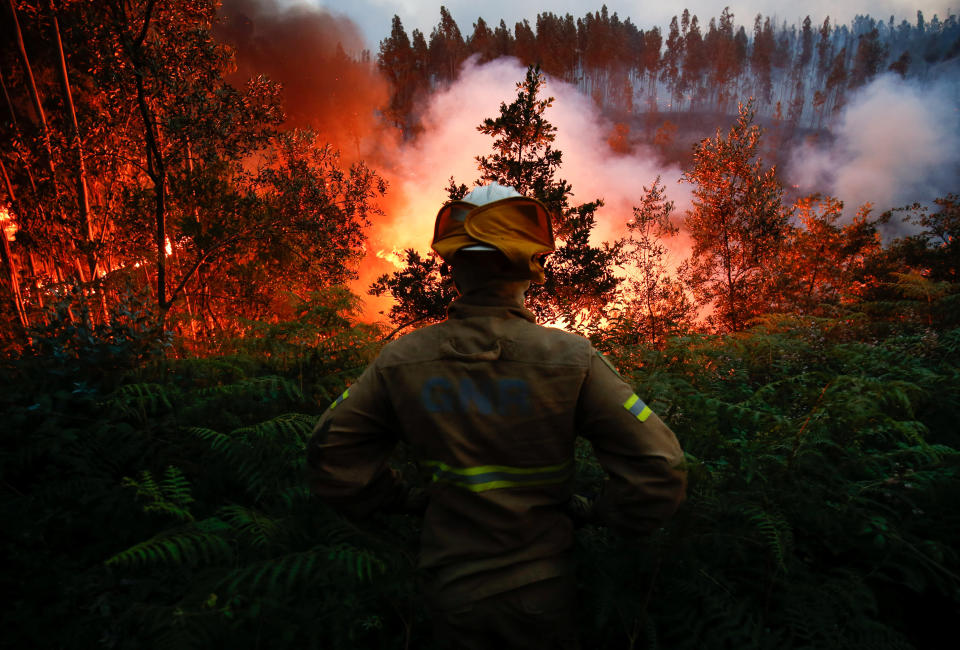 A firefighter watches a&nbsp;blaze near the village of Fato in central Portugal on June 18, 2017. (Photo: Rafael Marchante / Reuters)