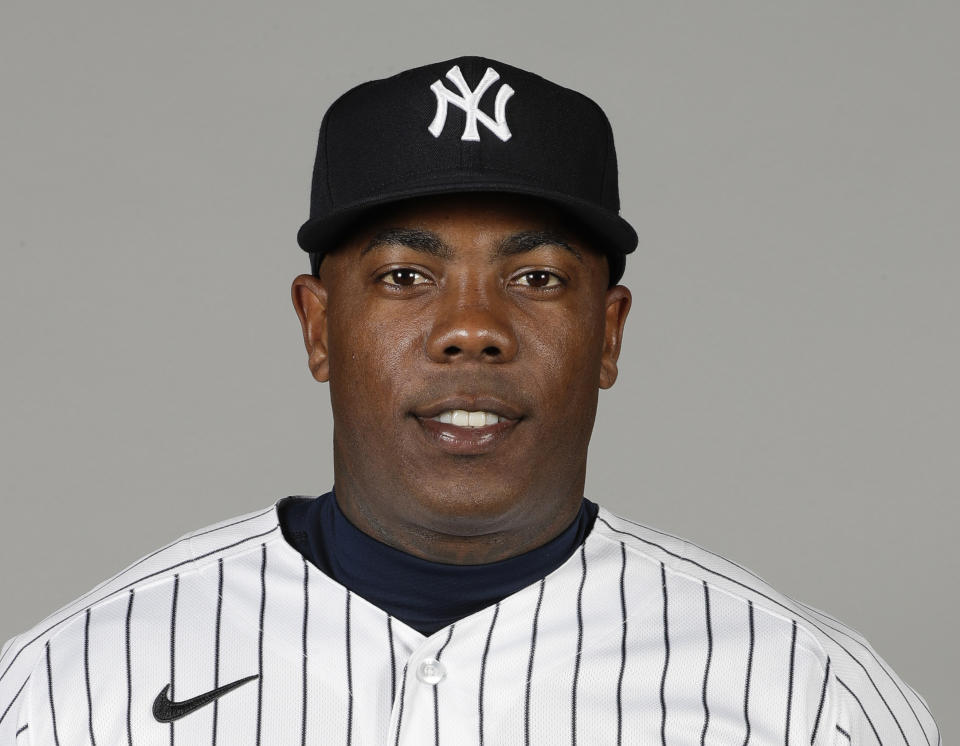 FILE - In this Feb. 20, 2020, file photo, New York Yankee closer Aroldis Chapman poses for a photo in Tampa Fla. Yankees manager Aaron Boone announced Saturday, July 11, 2020, that Chapman has tested positive for the coronavirus and is experiencing mild symptoms. (AP Photo/Frank Franklin II, File)