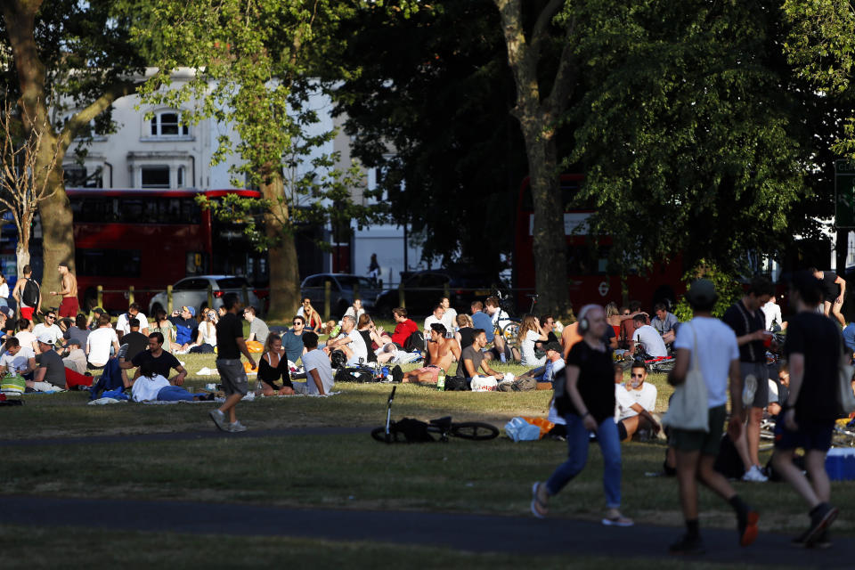 People socialise in groups on a busy Clapham Common, London, on Bank Holiday Monday after the introduction of measures to bring the country out of lockdown due to the coronavirus pandemic.