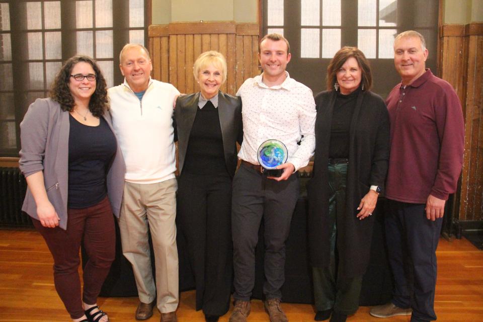 Representatives of Progressive Foundry pose for a photo with Lynsi Pasutti, Perry Chamber Executive Director, after receiving the Spirit of Perry Business of the Year Award during the chamber's annual dinner on Tuesday, April 4, 2023, at La Poste.