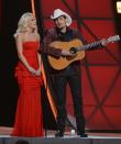 NASHVILLE, TN - NOVEMBER 01: Co-hosts Carrie Underwood and Brad Paisley present during the 46th annual CMA awards at the Bridgestone Arena on November 1, 2012 in Nashville, United States. (Photo by Jason Kempin/Getty Images)