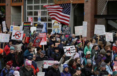 People demonstrate during a "March For Our Lives" demonstration demanding gun control in Seattle, Washington, U.S. March 24, 2018. REUTERS/Jason Redmond