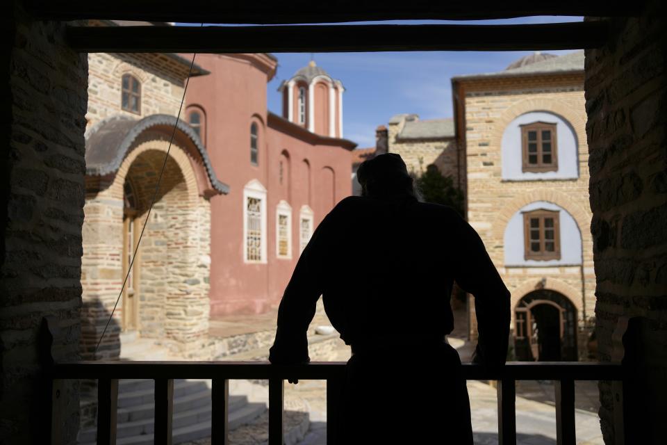 A monk stands at the Pantokrator Monastery in the Mount Athos, northern Greece, on Thursday, Oct. 13, 2022. The monastic community was first granted self-governance through a decree by Byzantine Emperor Basil II, in 883 AD. Throughout its history, women have been forbidden from entering, a ban that still stands. This rule is called "avaton" and the researchers believe that it concerns every form of disturbance that could affect Mt. Athos. (AP Photo/Thanassis Stavrakis)