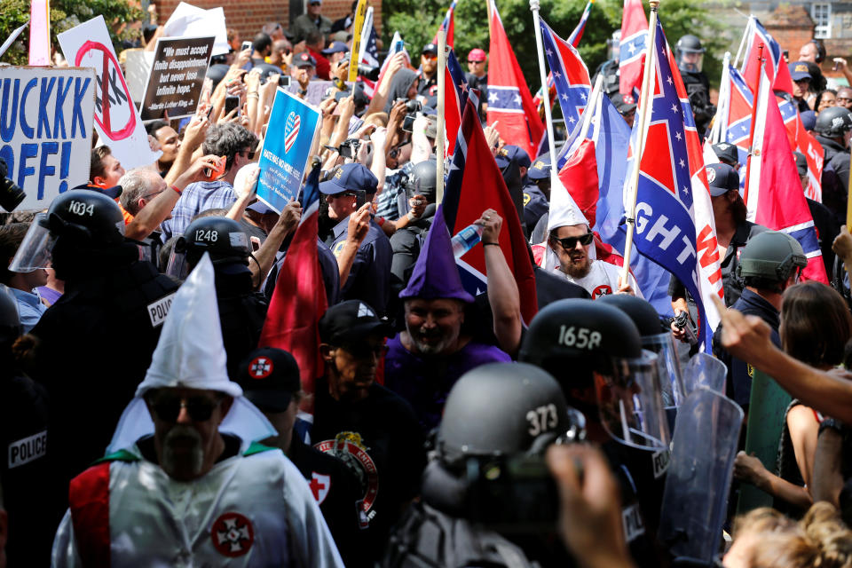 Riot police protect members of the Ku Klux Klan from counter-protesters as they arrive to rally in support of Confederate monuments in Charlottesville, Virginia, U.S. July 8, 2017. (Photo: Jonathan Ernst / Reuters)